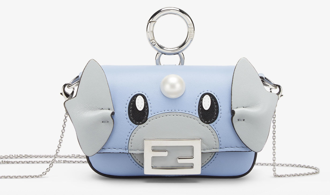 Purse themed around Dratini. There are leather flaps ruffled to look like Dratini's ears/wings. THere is a pearl between Dratini's eyes.