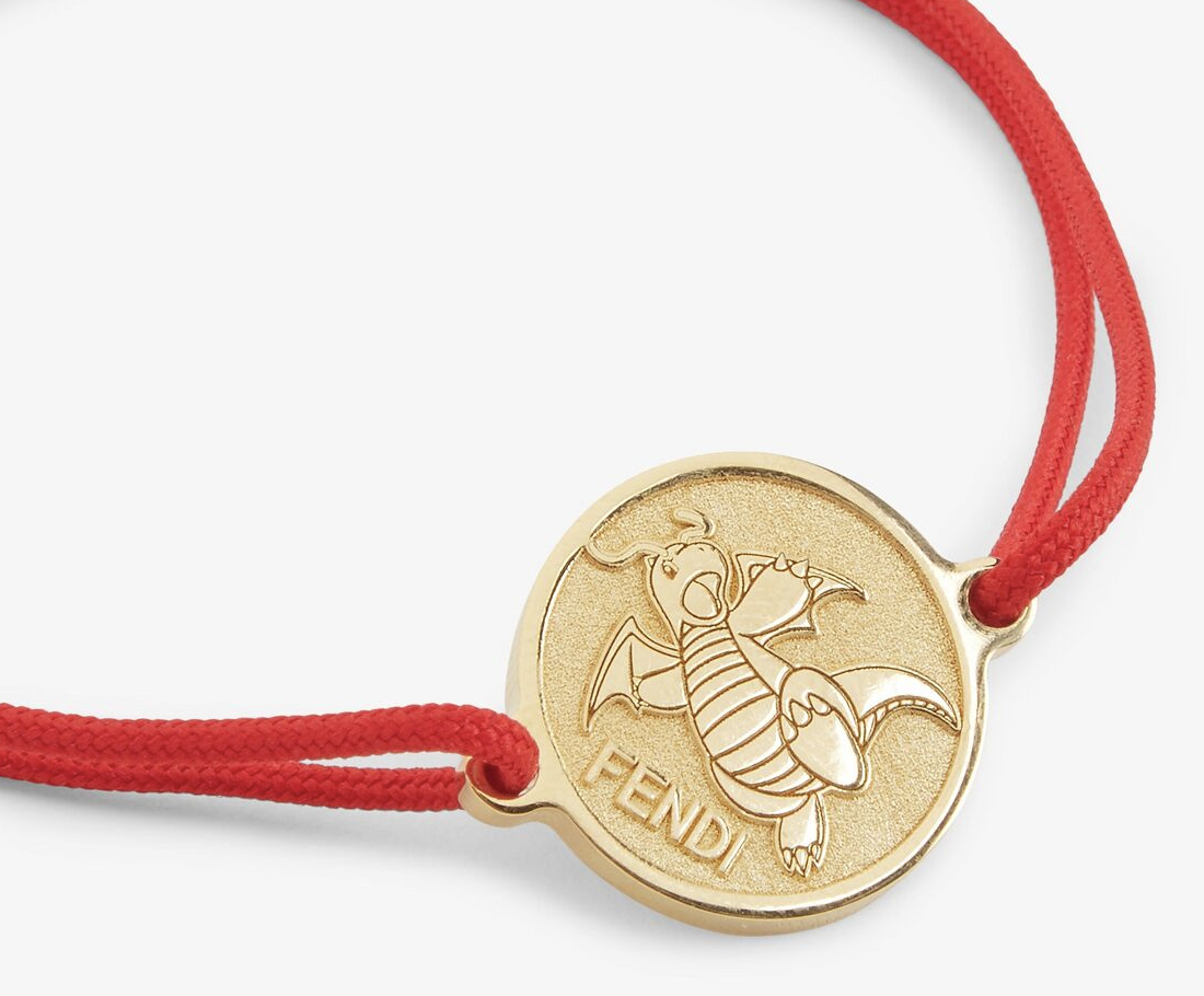 Coin bracelet with Dragonite and Fendi on it