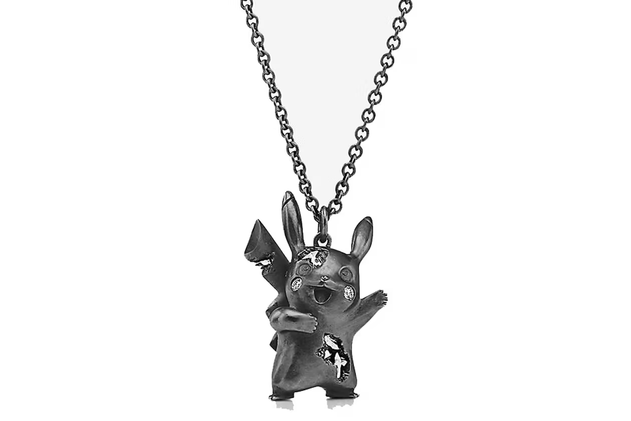 A black chain with a black Pikachu charm. The black Pikachu has its arms raised and has diamonds embedded in it.